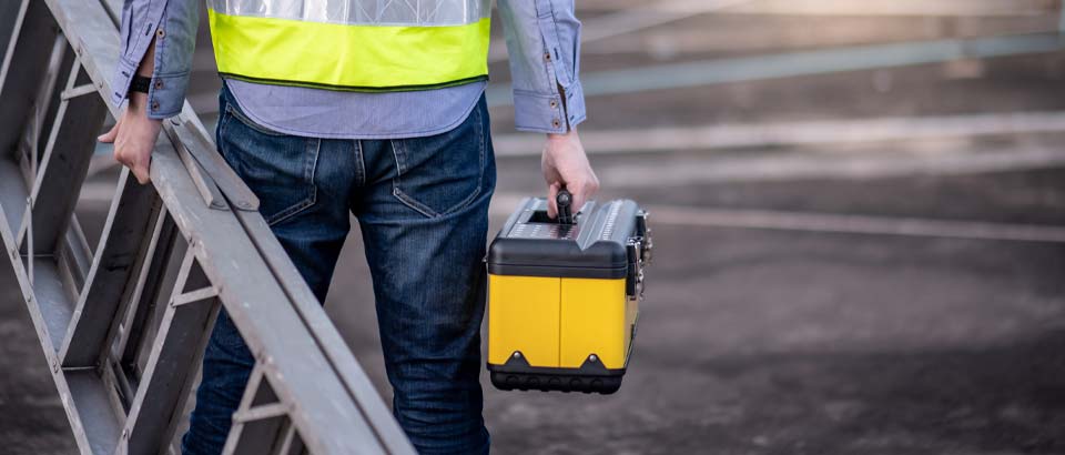 man holding toolbox