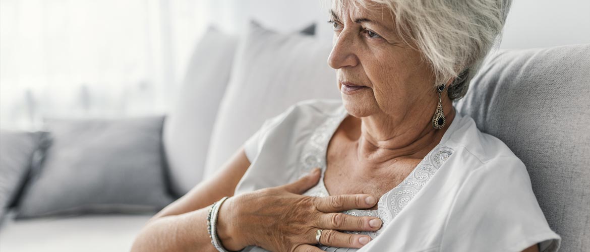 woman resting hand on chest over heart