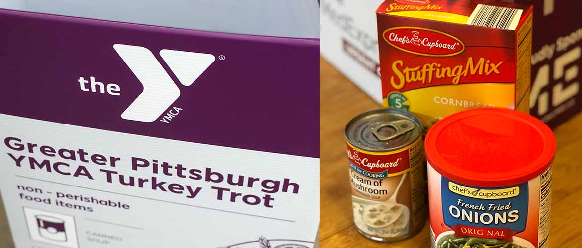 a MedExpress donation box for the YMCA's Greater Pittsburgh Community Food Bank collection along with some donated items, including stuffing mix and cream of mushroom soup