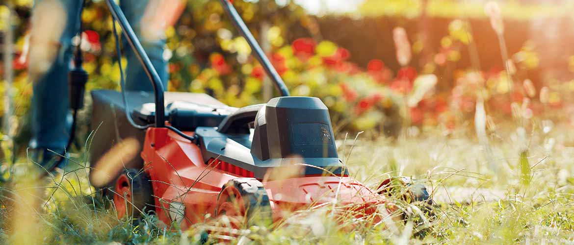 close up of mower cutting the grass