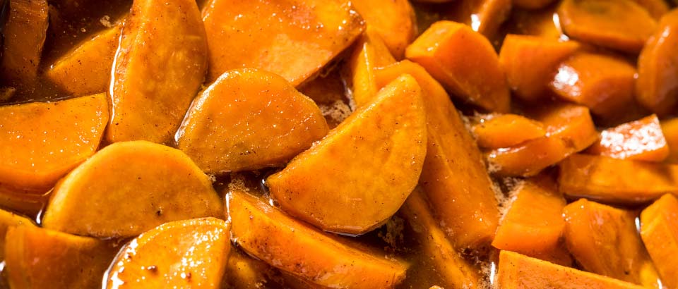 bowl of maple glazed sweet potatoes