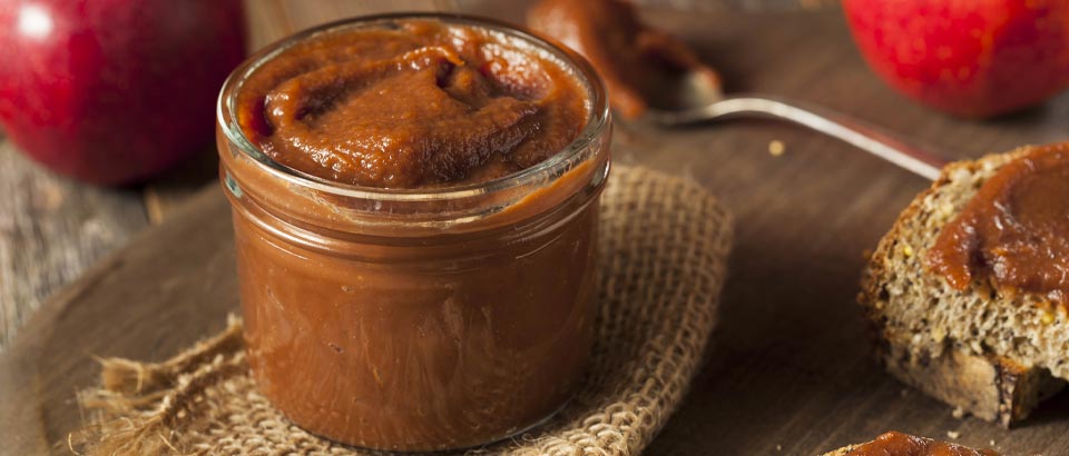 glass container of spiced apple butter
