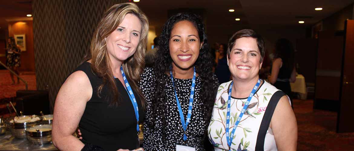 Arlene Neal with two other MedExpress employees at a conference