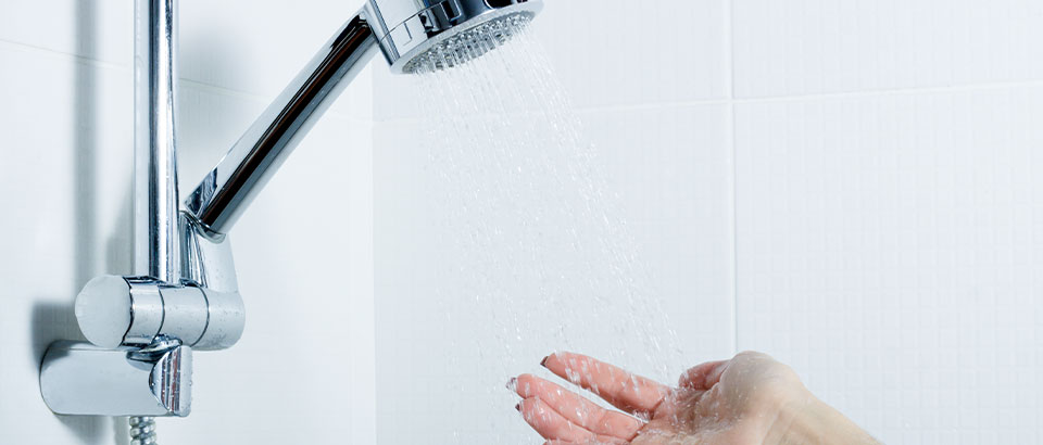 hand under shower water