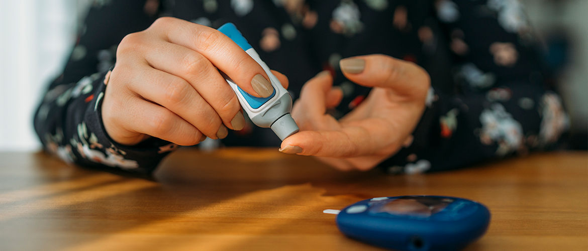 female checking blood sugar levels