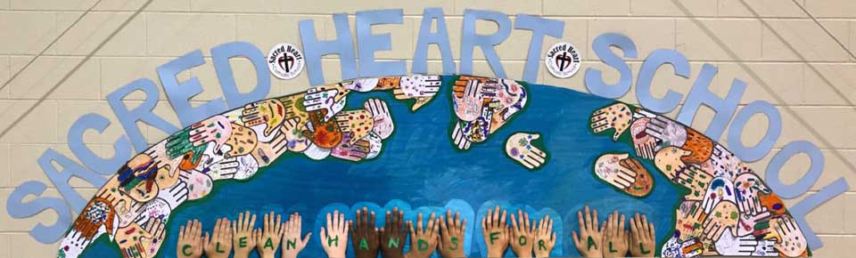 hands cut out and displayed on a wall with childrens hands below them