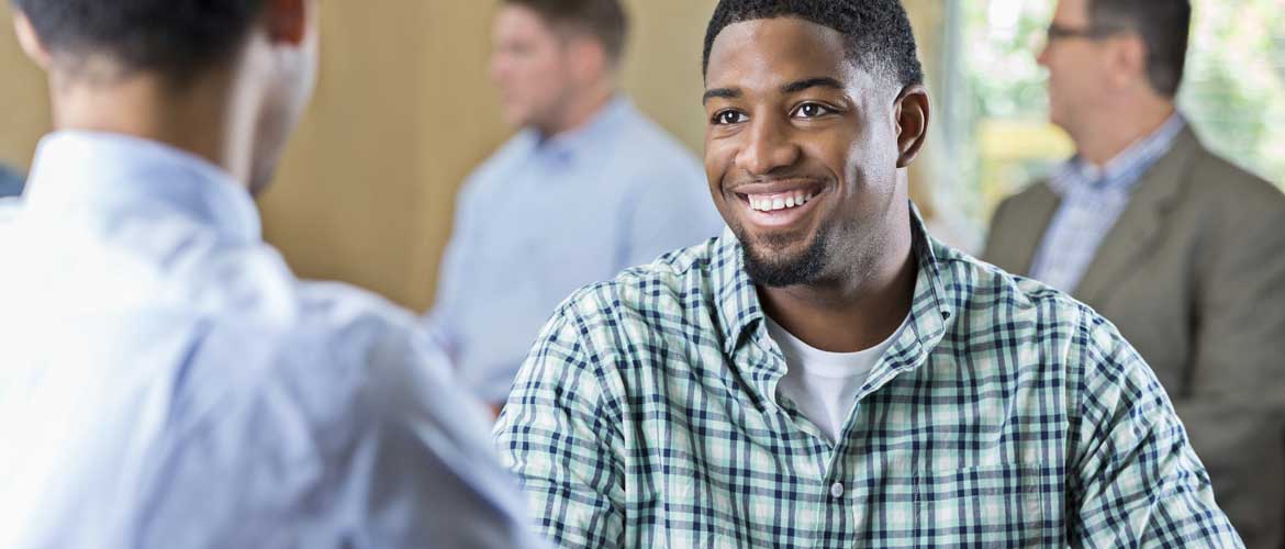 Man smiling at his recruiter.