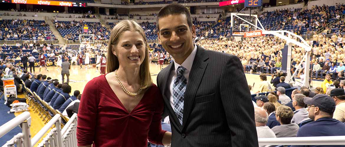 Doctor Adam Abdulally and his wife at a University of Pittsburgh basketball game