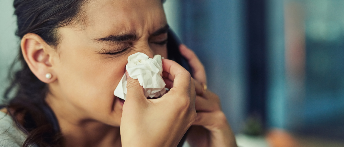 woman blowing her nose
