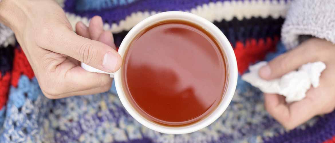 woman holding mug of tea