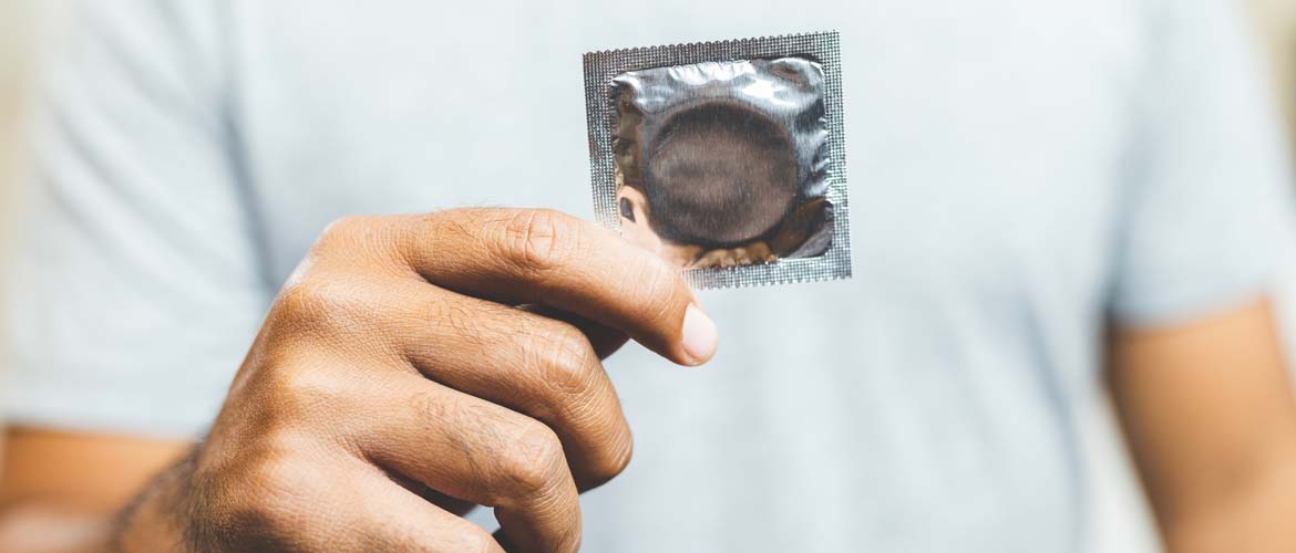 a man holding a condom