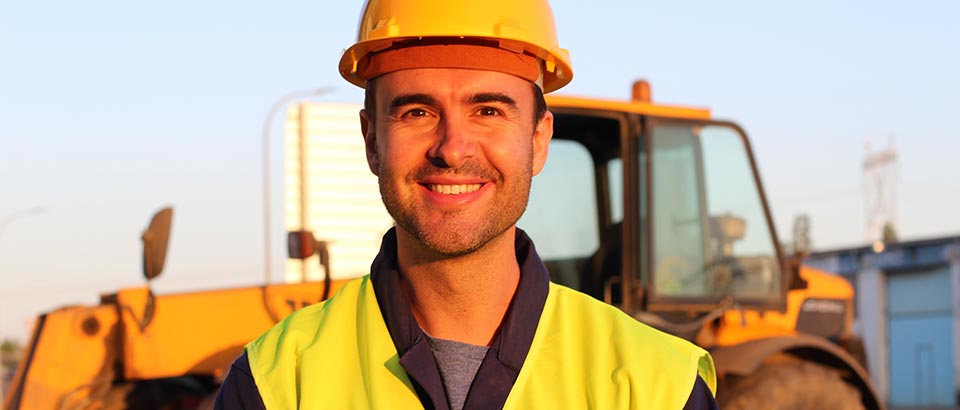 a man wearing a hard hat at a construction site