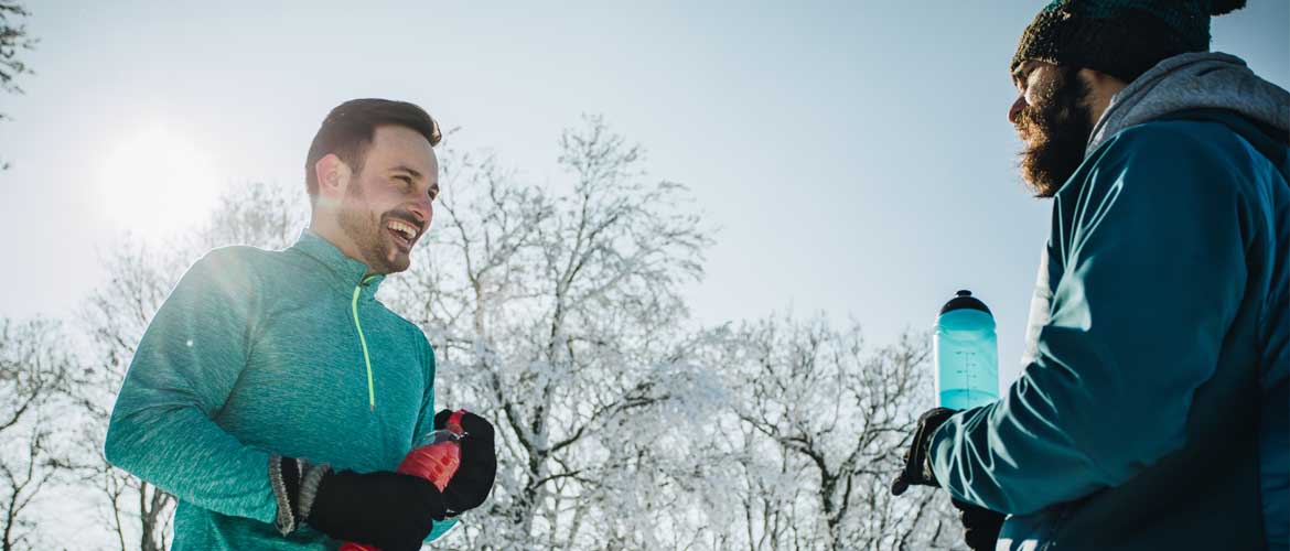 two men talking after a workout