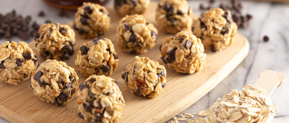 oatmeal balls with chocolate chips on cutting board