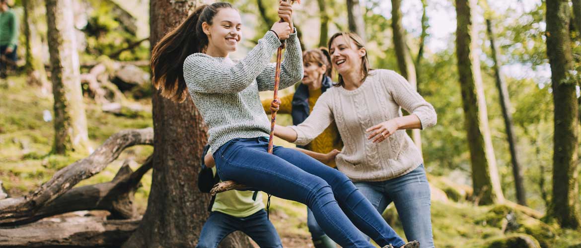 girls swinging on a swing