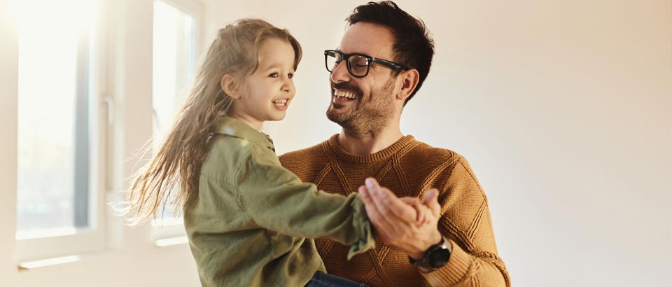 man holding young girl