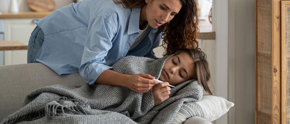 A mother taking care of sick teenager